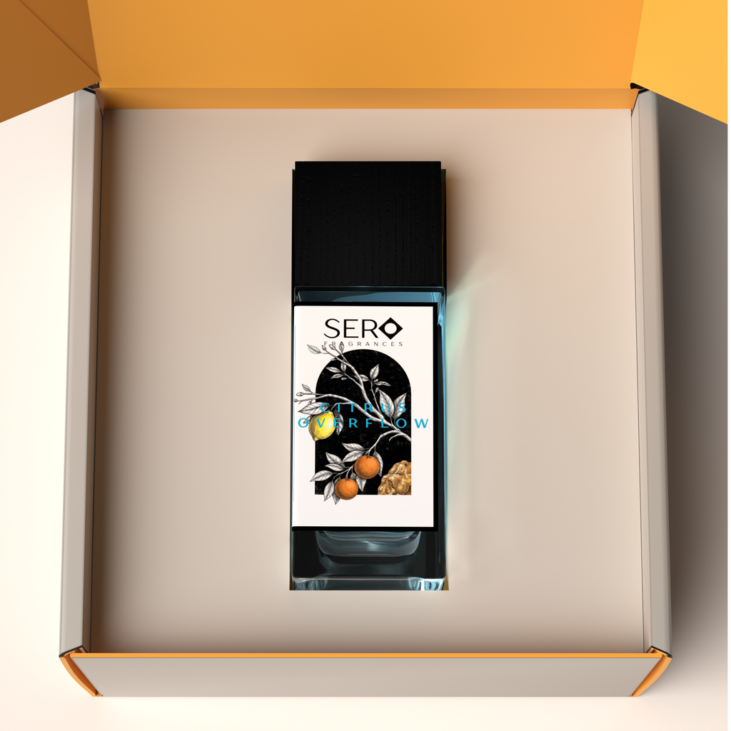Top view of a packaging within it a minimalist clear glass perfume bottle with black wood cap containing SERO fragrance inspired by LV AFTERNOON SWIM. 