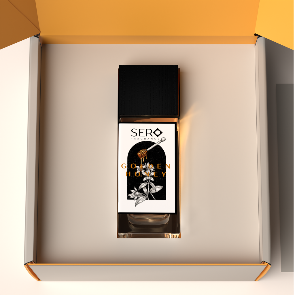 Top view of a packaging within it a minimalist clear glass perfume bottle with black wood cap containing SERO fragrance inspired by Parfums de Marly Althaïr. 
